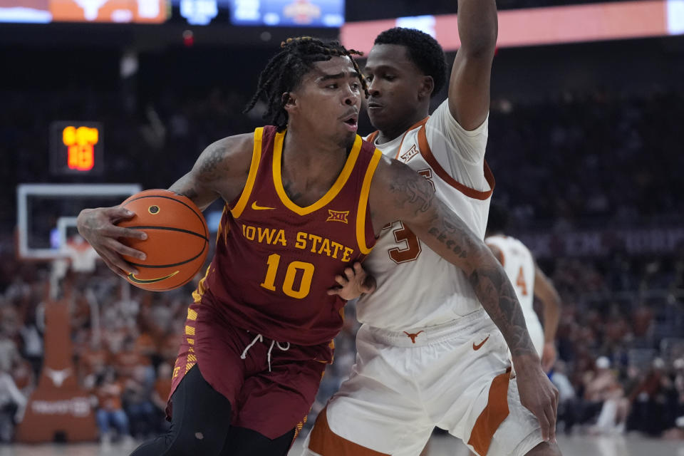 Iowa State guard Keshon Gilbert (10) is defended by Texas guard Max Abmas (3) during the first half of an NCAA college basketball game in Austin, Texas, Tuesday, Feb. 6, 2024. (AP Photo/Eric Gay)