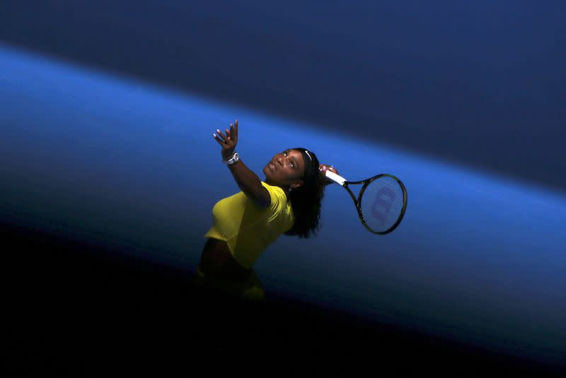 FILE PHOTO: Williams of the U.S. serves during her first round match against Italy's Giorgi at the Australian Open tennis tournament at Melbourne Park, Australia