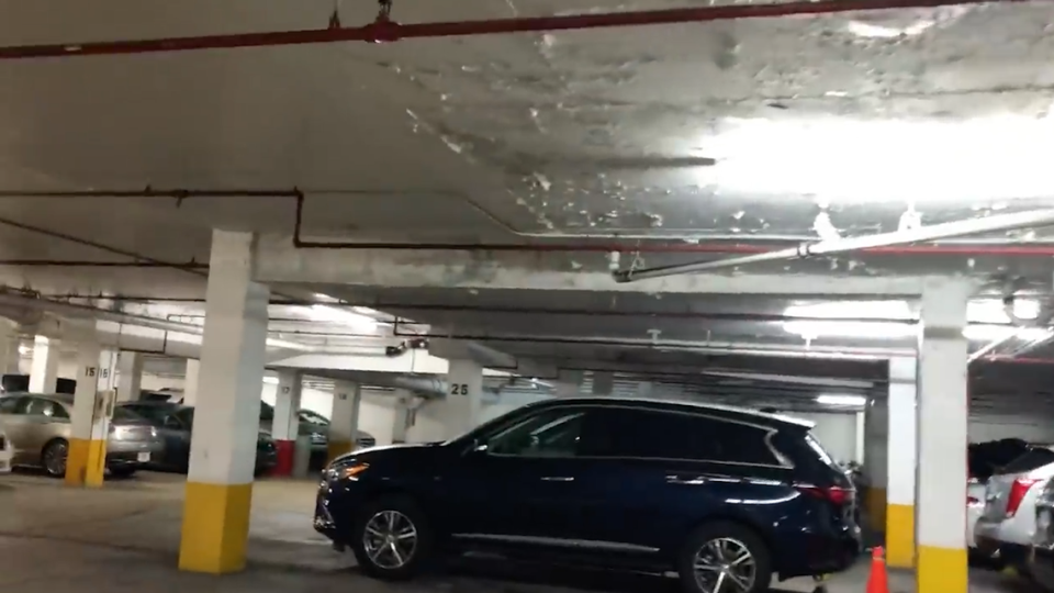 Roughness visible on the ceiling of the garage directly beneath the pool deck shown in 2020 video. Experts are unclear on the cause.