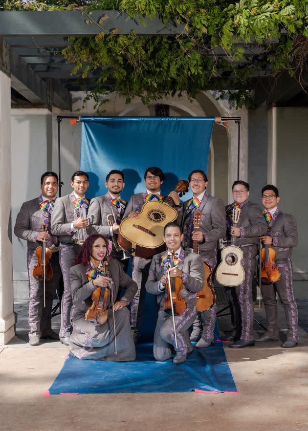 (Clockwise) Raul Vidal, Hector Castro, Jeremy Rodriguez, Saulo Garcia, Ricardo Dollero, Sammi Bautista, Edwin Martinez, Carlos Samaniego and Natalia Melendez, members of Mariachi Arcoiris, an L.A. based group and the world's first all-LGBTQ mariachi band, pose for a portrait at the Long Beach Proud Festival in Los Angeles on May 20, 2023.