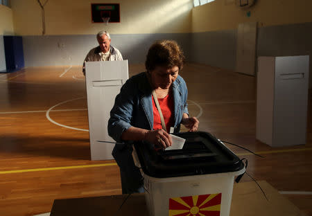 People cast their ballot for the referendum in Macedonia on changing the country's name that would open the way for it to join NATO and the European Union in Skopje, Macedonia September 30, 2018. REUTERS/Marko Djurica