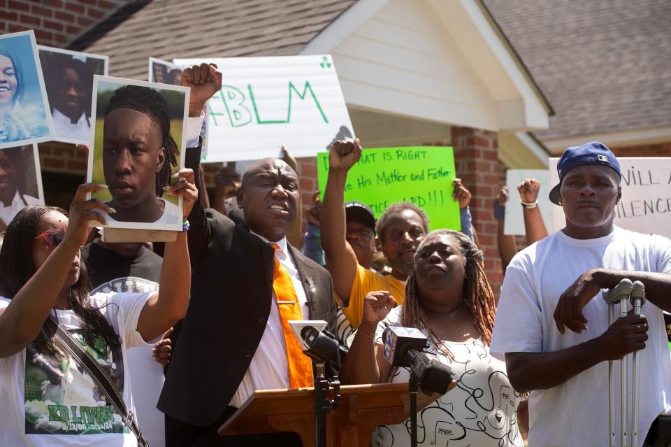 Civil Rights attorney Ben Crump, left of center, joins Kaychia Calvert, left, and Patrick Smith, right, parents of 17-year-old Kadarius Smith, in calling for the release of the dash cam video of the death of their son during a news conference in Leland, Tuesday, April 16, 2024. Kadarius Smith was allegedly run down by a Leland Police cruiser on March 21.