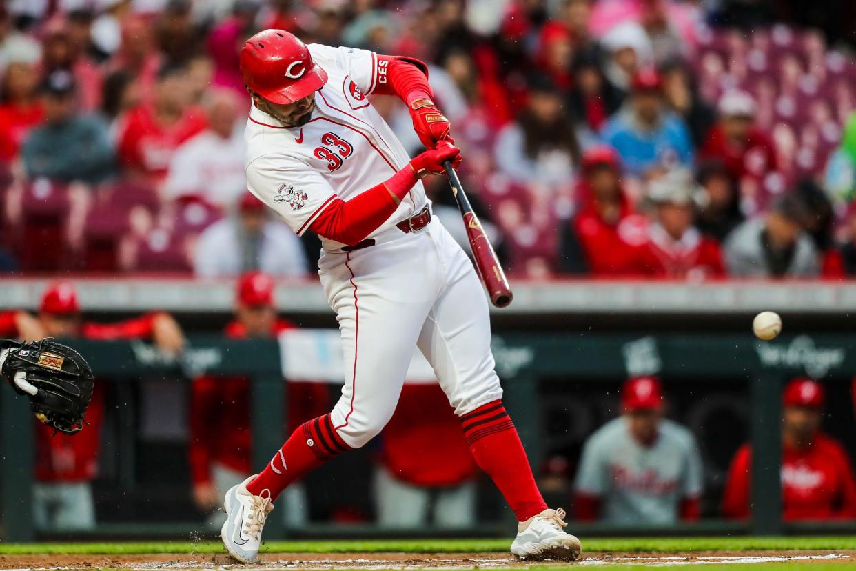 Apr 23, 2024; Cincinnati, Ohio, USA; Cincinnati Reds first baseman Christian Encarnacion-Strand (33) hits a RBI double against the Philadelphia Phillies in the first inning at Great American Ball Park.