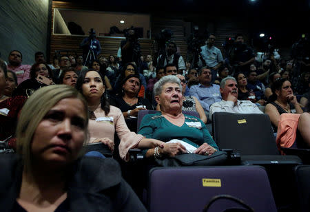 Relatives of five youths killed in 2016 after police kidnapped them and then turned them over to members of a drug gang, react during a public apology by the Veracruz state government, in Mexico City, Mexico March 4, 2019. REUTERS/Daniel Becerril