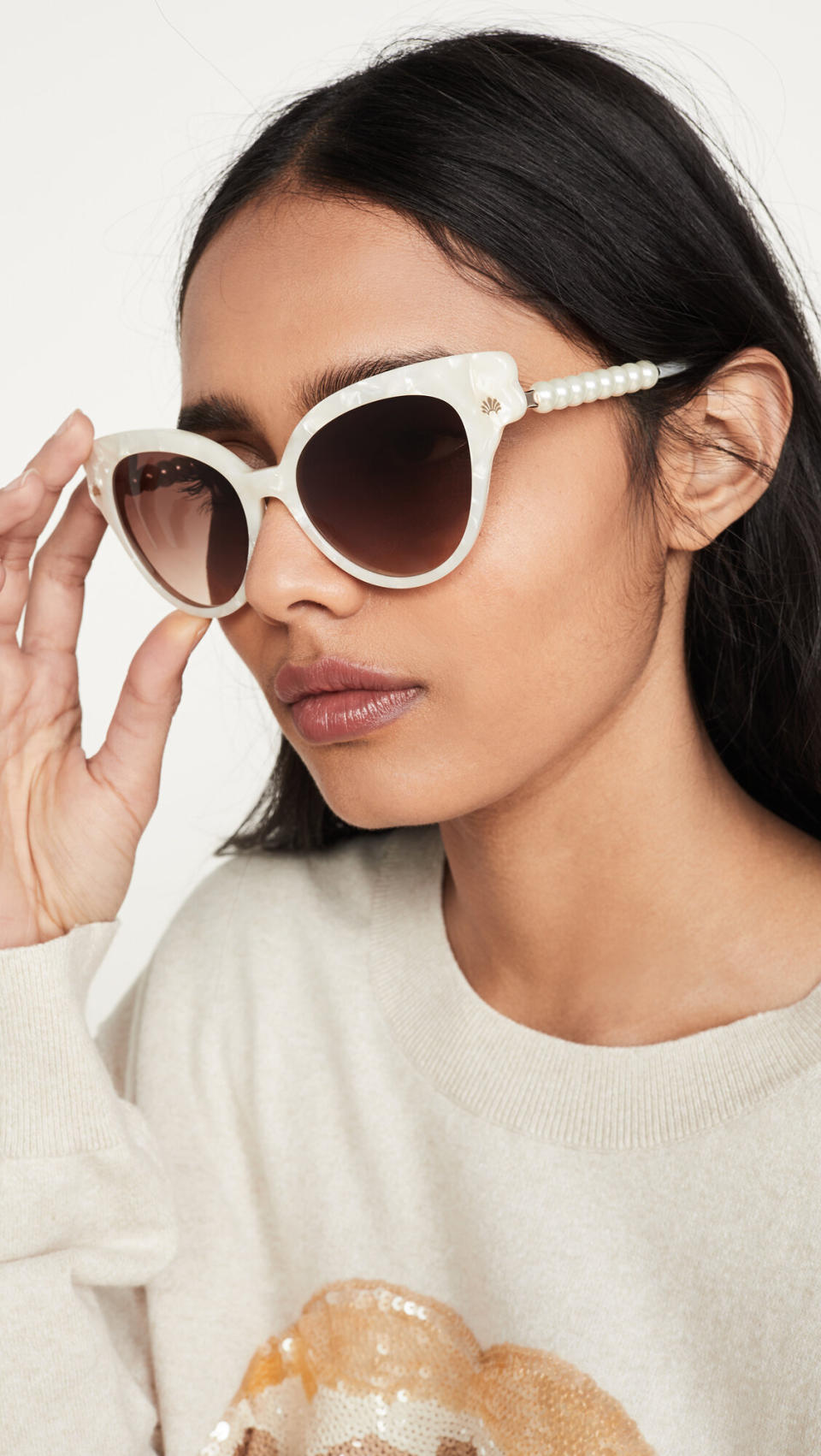 "With the days getting sunnier, I've been hoping to find sunglasses that I can wear on walks in my neighborhood. I've been really into <a href="https://fave.co/2wExC0O" target="_blank" rel="noopener noreferrer">Lele Sadoughi's designs</a> lately, especially since she tends to go maximalist with her work (like pearls, gemstones, glitter and prints). I liked the vintage feel of these sunglasses and couldn't resist the pearls on the side." <strong>&mdash; Pardilla <br /><br /></strong><a href="https://fave.co/2WNbkEz" target="_blank" rel="noopener noreferrer">Find them for $195 at Shopbop.</a>