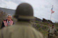 World War II D-Day veteran and Penobscot Elder from Maine, Charles Norman Shay, left, participates in a Native American ceremony at his memorial overlooking Omaha Beach in Saint-Laurent-sur-Mer, Normandy, France, Friday, June 5, 2020. Saturday's anniversary of D-Day will be one of the loneliest remembrances ever, as the coronavirus pandemic is keeping almost everyone away, from government leaders to frail veterans who might not get another chance for a final farewell to their unlucky comrades. (AP Photo/Virginia Mayo)