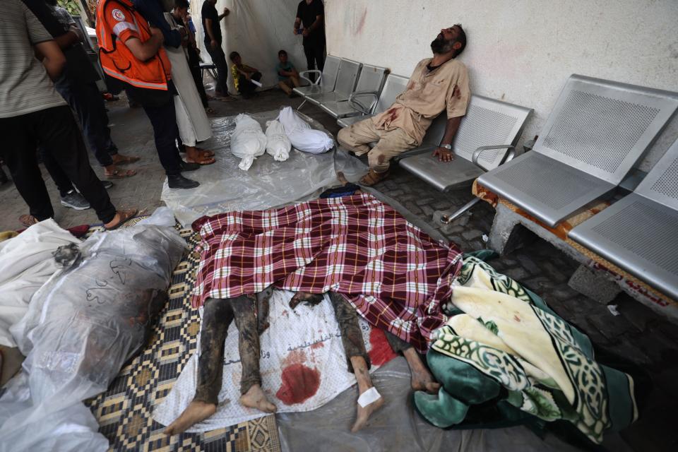 Palestinian victims are laid out on the ground at a hospital in Rafah.