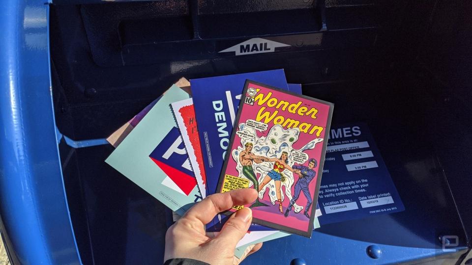 Postcards being put in a mailbox