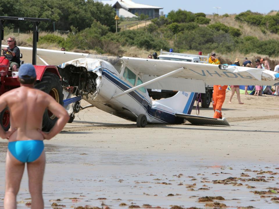 The Cessna 172B light plane that crashed just off the beach at Torquay was dragged along the beach. The 19 year-old pilot was not seriously injured.