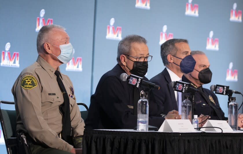 LOS ANGELES, CA - FEBRUARY 08: Los Angeles County Sheriff's Chief Jack W. Ewell, left; Los Angeles Police Department Chief Michael Moore; Los Angeles Mayor Eric Garcetti and Inglewood Police Department Chief Mark Fronterotta discuss safety plans for the Super Bowl at SoFi Stadium during a press conference at the Los Angeles Convention Center on Tuesday, Feb. 8, 2022. (Myung J. Chun / Los Angeles Times)