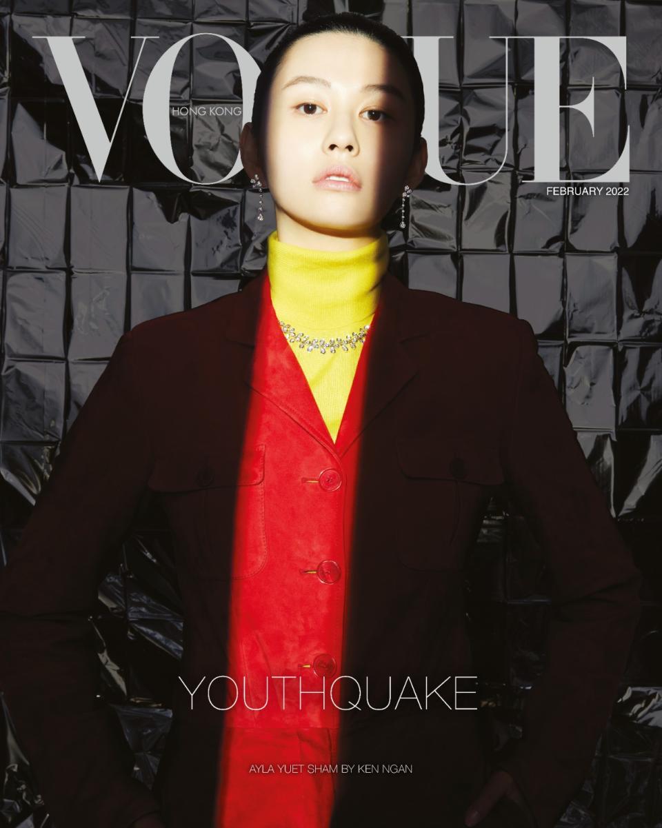 Ayla, known by her Chinese name Sham Yuet, wears a striking red jacket over a bright yellow roll-neck jumper (Vogue Hong Kong/Luigi & Iango/PA)