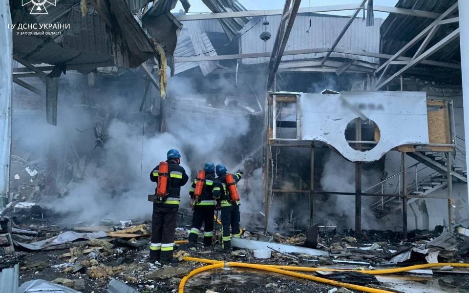 Emergency workers at a site where a missile killed one in  - SESU UA