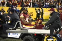 Washington Football Team running back J.D. McKissic (41) is carted off the field after being injured during the second half of an NFL football game against the Seattle Seahawks, Monday, Nov. 29, 2021, in Landover, Md. (AP Photo/Nick Wass)