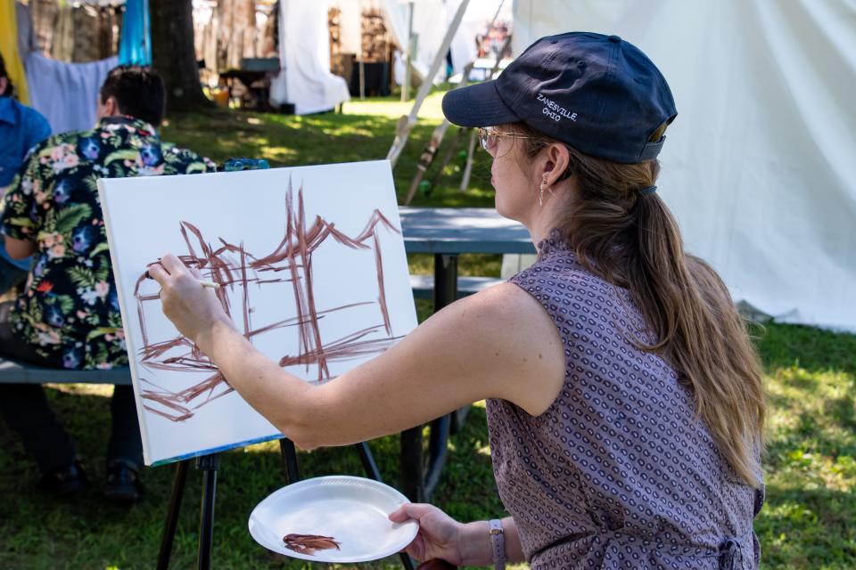 Carrie Turner begins another masterpiece painting at the Salt Fork Arts and Crafts festival. Turner is a well-known, Zanesville-based artist, who is currently showing at the Bunko Jess Gallery.