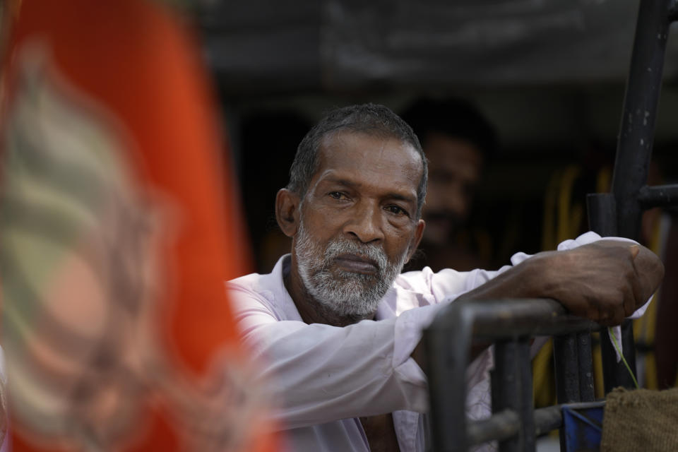 A Muslim passerby stops to listen to the ruling Bharatiya Janata Party's only Muslim candidate during an election campaigns in Malappuram, in Indian southern state of Kerala, on April 24, 2024. (AP Photo/Manish Swarup)