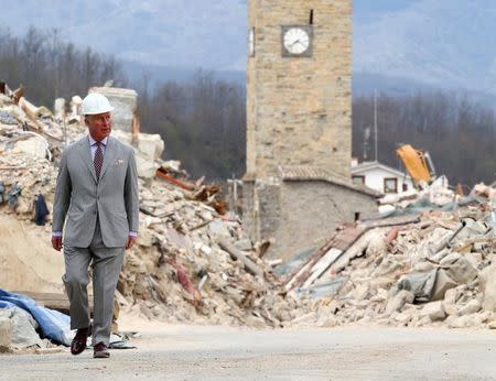 Britain's Prince Charles walks during his visit to the town of Amatrice, which was levelled after an earthquake last year, in central Italy April 2, 2017. REUTERS/Alessandro Bianchi