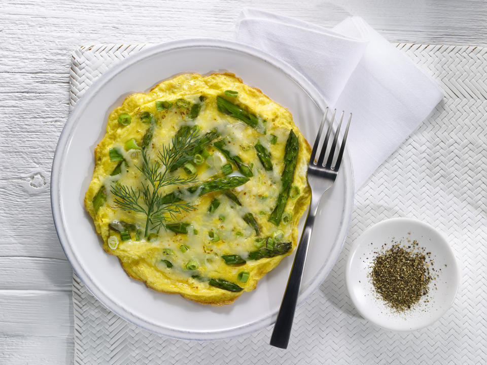 A quick, easy and delicious way to serve asparagus is in an omelette with cheese, spring onions and your choice of additional veg or meat. (Getty Images)