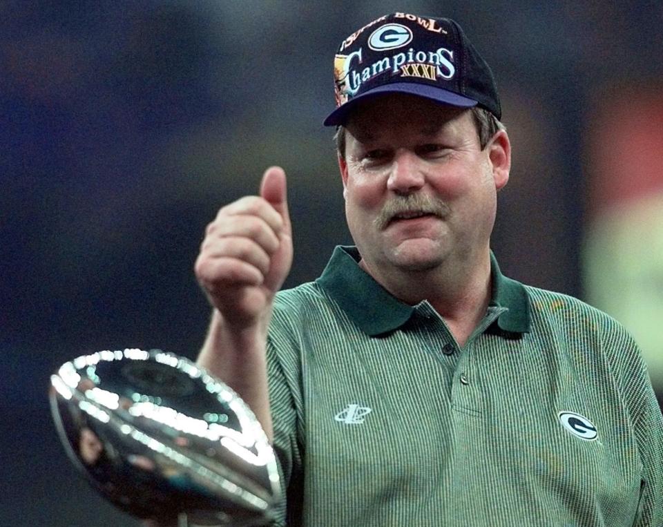 In this Jan. 26, 1997, file photo, Green Bay Packers coach Mike Holmgren gives a thumbs up behind the Lombardi Trophy after the Packers beat the <a class="link " href="https://sports.yahoo.com/nfl/teams/new-england/" data-i13n="sec:content-canvas;subsec:anchor_text;elm:context_link" data-ylk="slk:New England Patriots;sec:content-canvas;subsec:anchor_text;elm:context_link;itc:0">New England Patriots</a> 35-21 to win Super Bowl XXXI NFL football game in <a class="link " href="https://sports.yahoo.com/nfl/teams/new-orleans/" data-i13n="sec:content-canvas;subsec:anchor_text;elm:context_link" data-ylk="slk:New Orleans;sec:content-canvas;subsec:anchor_text;elm:context_link;itc:0">New Orleans</a>. | Ed Reinke, Associated Press