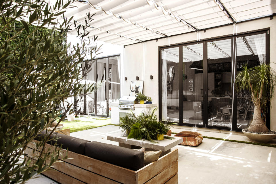 patio with sun shade sails by Kate Anne Designs