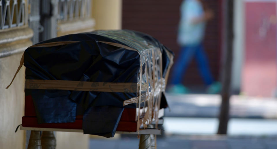 Another coffin seen outside a building in Guayaquil on April 2, 2020. Source: EPA via AAP