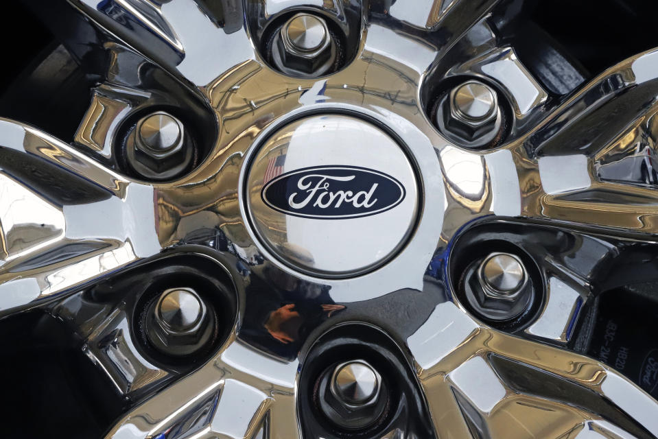 FILE- In this Feb. 14, 2019, file photo a wheel on a 2019 Ford Expedition 4x4 is displayed at the 2019 Pittsburgh International Auto Show in Pittsburgh. Ford Motor Co. said Tuesday, March 19, it will shift 550 jobs to its Kentucky Truck Plant to boost production of its Expedition and Lincoln Navigator to meet growing demand for its large SUVs. (AP Photo/Gene J. Puskar, File)