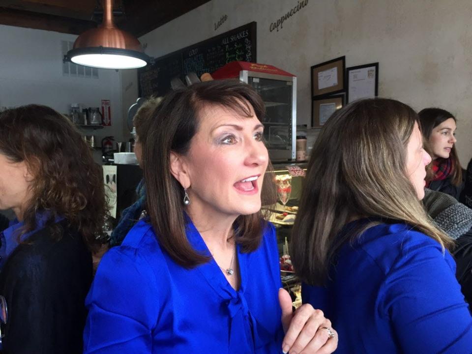 In this Feb. 13, 2018 photo Democratic candidate for the 3rd congressional district Marie Newman speaks with supporters at a campaign event in LaGrange, Ill. Newman is a political newcomer challenging US Rep. Dan Lipinski in the March 20 primary.