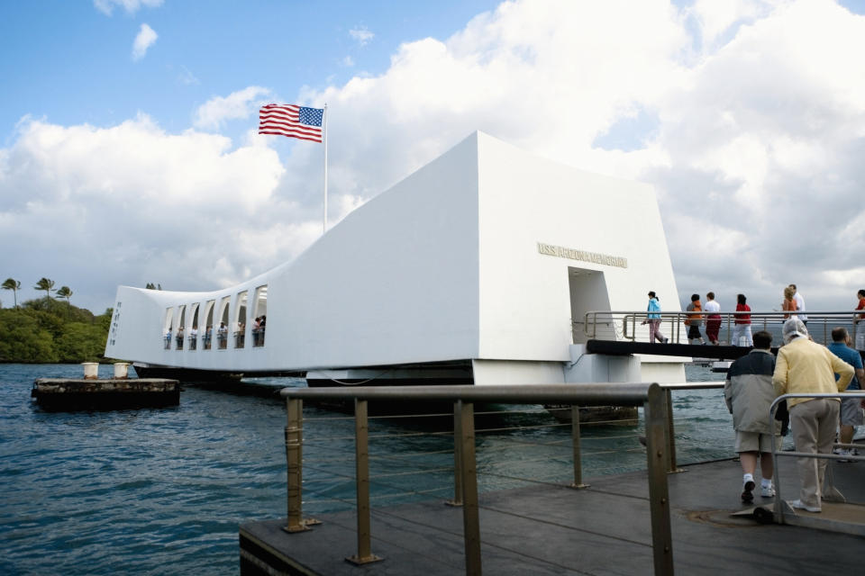 people lining up to go into a memorial