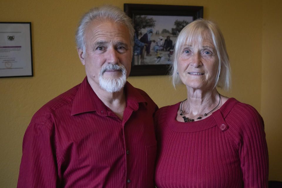 Jeff Woodke, and his wife, Els, pose for a photo at their home in McKinleyville, Calif., Monday, June 5, 2023. American missionary Jeff Woodke was taken by Islamic extremists in Niger and held in captivity for six-and-a-half years. Woodke and his wife, Els, recently spoke to The Associated Press in their first joint interview, sharing previously unreported details about his captivity and their frustrating interactions with the U.S government. (AP Photo/Shaun Walker)