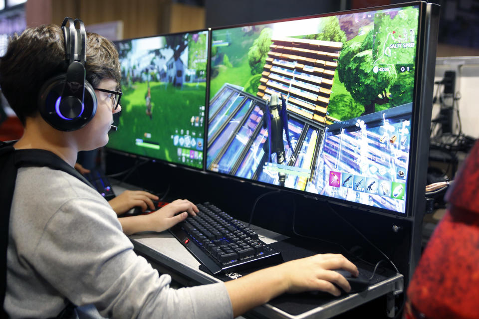 PARIS, FRANCE - OCTOBER 26:  A gamer plays the video game 'Fortnite Battle Royale' developed by Epic Games during the 'Paris Games Week' on October 26, 2018 in Paris, France. 'Paris Games Week' is an international trade fair for video games and runs from October 26 to 31, 2018.  (Photo by Chesnot/Getty Images)