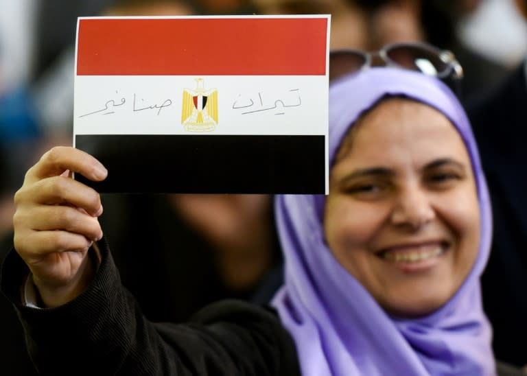 An Egyptian woman celebrates after the High Administrative Court voted to void a government agreement to hand over the two Red Sea islands of Tiran and Sanafir to Saudi Arabia