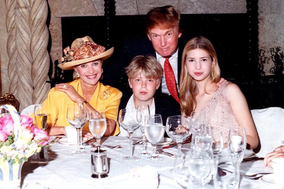 Family portrait of, from left, socialite Ivana Trump, her son Eric Trump, her former husband businessman Donald Trump, and her daughter Ivanka Trump as they sit at a table at the Mar-a-Lago estate, Palm Beach, Florida, 1998. (Photo by Davidoff Studios/Getty Images)