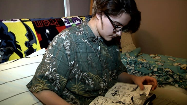 Arthur Brown, who is transgender -- born female but now identifying as male, reads a comic book at his house in Chicago, Illinois on on May 17, 2016