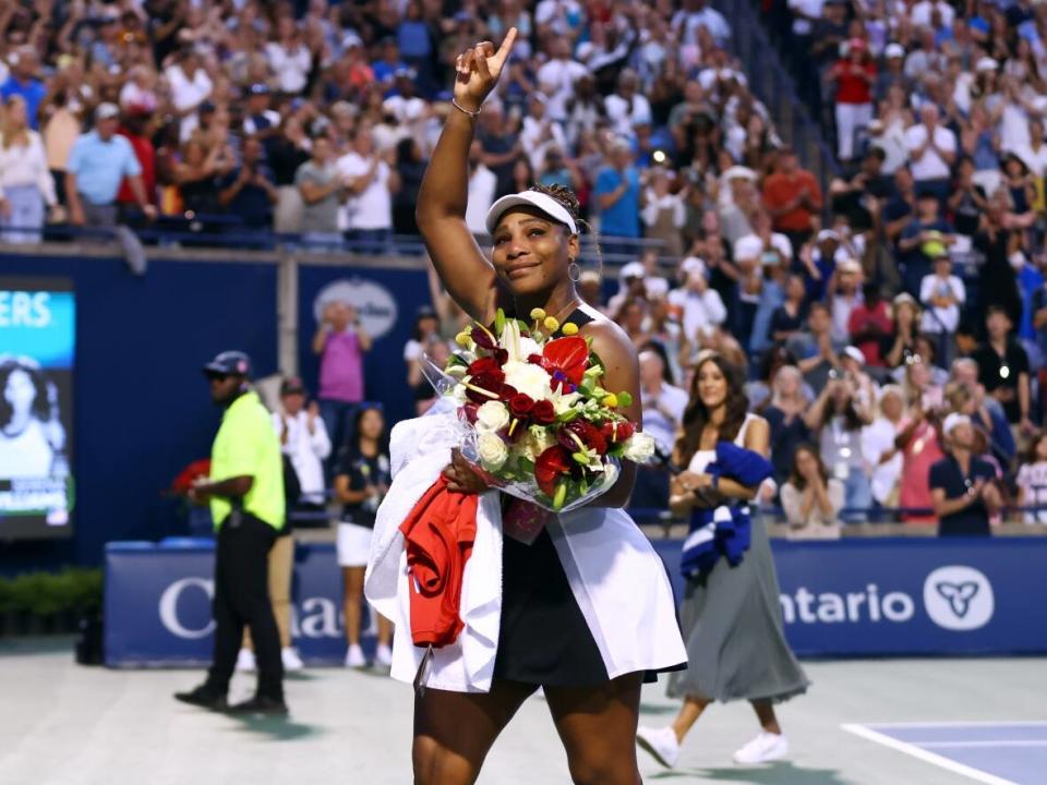 Serena Williams waves to the crowd in Toronto as she leaves the court after losing to Belinda Bencic of Switzerland at the National Bank Open. (Vaughn Ridley/Getty Images - image credit)