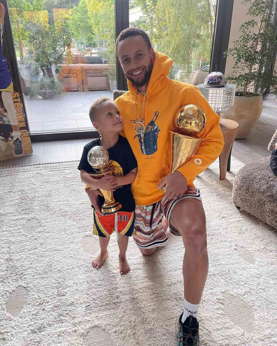 Canon and Steph Curry with trophy