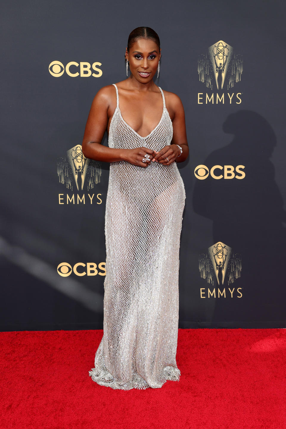 Issa Rae wearing a silver mesh dress at the 73rd Primetime Emmy Awards at L.A. LIVE on September 19, 2021 in Los Angeles, California. (Photo by Rich Fury/Getty Images)