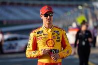 May 23, 2019; Concord, NC, USA; Monster Energy NASCAR Cup Series driver Joey Logano (22) walks to his carduring qualifying for the Coca-Cola 600 at Charlotte Motor Speedway. Mandatory Credit: Jim Dedmon-USA TODAY Sports