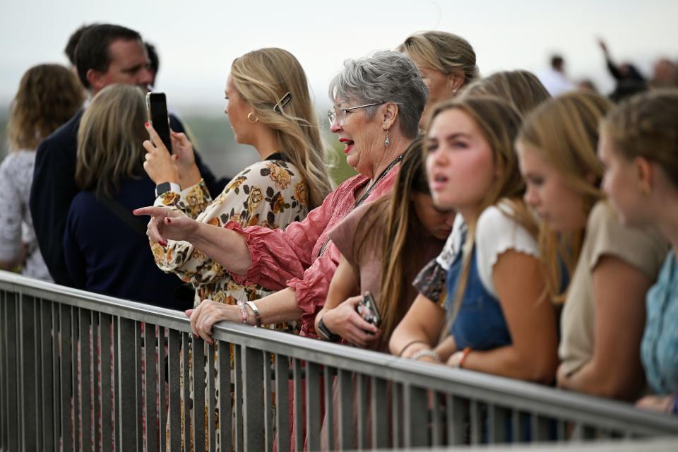 People stand and look out at the Salt Lake Temple after the Saturday afternoon session of the 193rd Semiannual General Conference of The Church of Jesus Christ of Latter-day Saints at the Conference Center in Salt Lake City on Saturday, Sept. 30, 2023. | Scott G Winterton, Deseret News