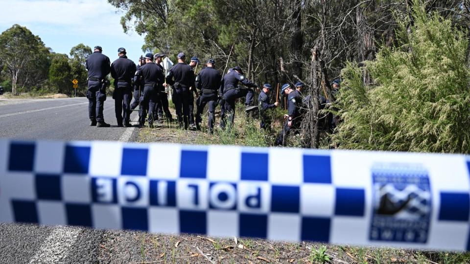 Police at the site where the bodies were found (file image)