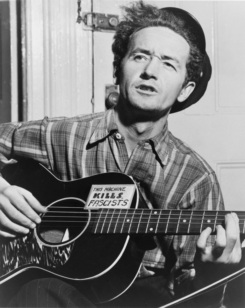 This circa 1943 photo courtesy of the Woody Guthrie Archives shows Oklahoma-born folk singer Woody Guthrie. The Woody Guthrie Center opens to the public on Saturday, April 27, 2013, with many interactive exhibits chronicling the life and work of Guthrie and is home to the folk singer’s archives. (AP Photo/Al Aumuller, Courtesy Woody Guthrie Archives)