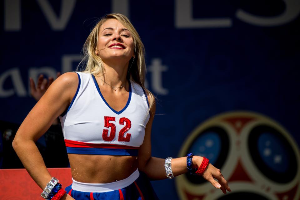 <p>A Russian cheerleader dances during the opening ceremony of the FIFA Fan Fest in Nizhny Novgorod on June 14, 2018, ahead of the Russia 2018 World Cup. (Photo by MARTIN BERNETTI / AFP) </p>