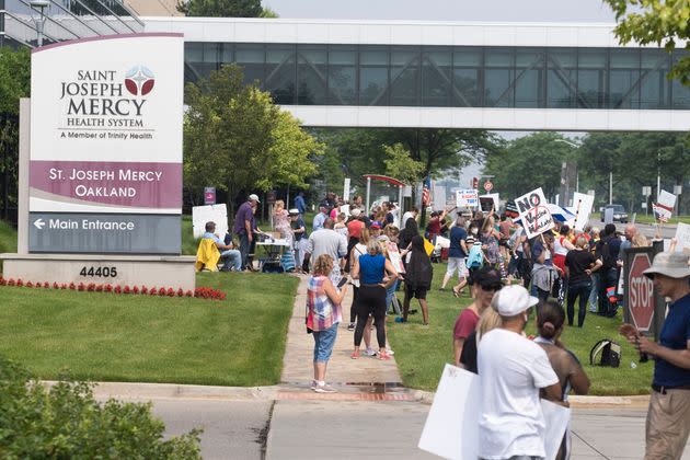 Health care workers and others gathered at several hospitals throughout Michigan on Saturday to protest the recent announcement by Trinity Health and Henry Ford Health systems that nurses and other health workers under their employment will be required to receive a COVID-19 vaccine. (Photo: SOPA Images via Getty Images)