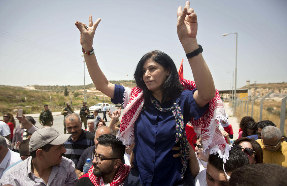 FILE - In this June 3, 2016 file photo, Palestinian lawmaker Khalida Jarrar is greeted by supporters after her release from an Israeli prison near the West Bank town of Tulkarem. An Israeli military court has sentenced Jarrar, Tuesday, March 2, 2021, to two years in prison in a plea bargain that convicted her of belonging to an outlawed group but dropped the most serious charges against her. (AP Photo/Majdi Mohammed, File)