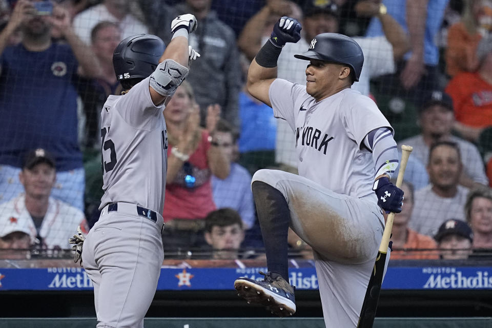New York Yankees' Oswaldo Cabrera, left, celebrates with Juan Soto after hitting a solo home run during the sixth inning of a baseball game against the Houston Astros, Thursday, March 28, 2024, in Houston. (AP Photo/Kevin M. Cox)