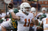 Texas' Sam Ehlinger (11) looks to pass against Baylor during the first half of an NCAA college football game in Austin, Texas, Saturday, Oct. 24, 2020. (AP Photo/Chuck Burton)