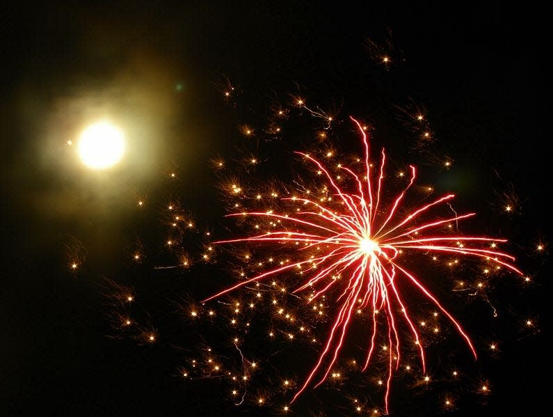 Fireworks seen with the bright moon in the background on New Year's Eve, 2009. [Photo by Dnalor 01 (Own work) [CC BY-SA 3 (https://creativecommons.org/licenses/by-sa/3)], via Wikimedia Commons]