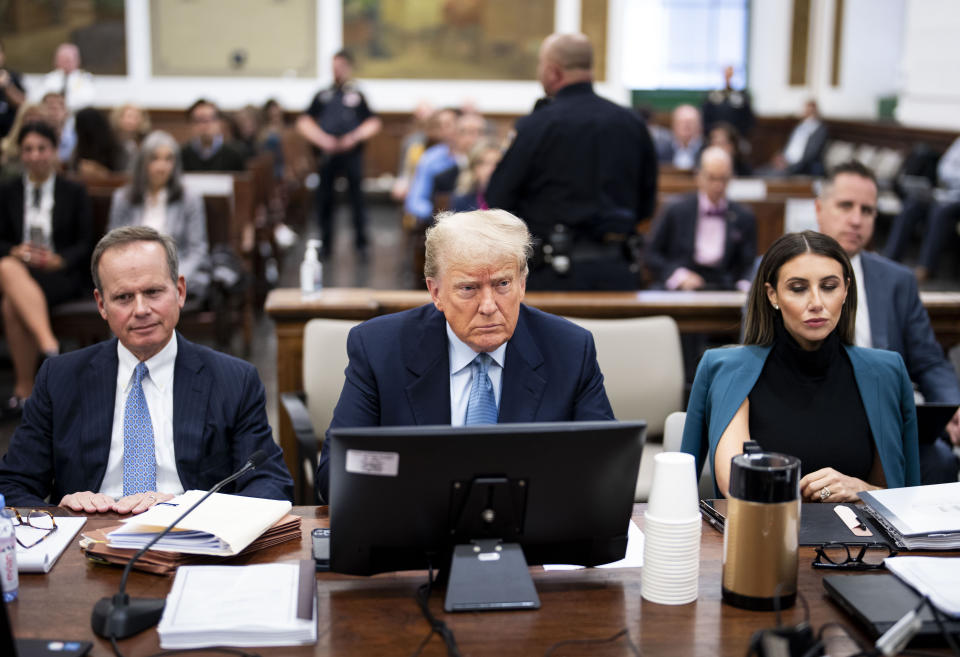 Former President Donald Trump sits in the courtroom with his legal team before the continuation of his civil business fraud trial at New York Supreme Court, Wednesday, Oct. 18, 2023, in New York. (Doug Mills/The New York Times via AP, Pool)