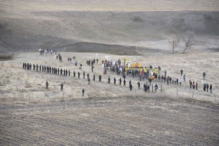 Protesters are confronted by police near a pipeline being built by a group of companies led by Energy Transfer Partners LP at a construction site in North Dakota, October 22, 2016, Photo courtesy Morton County Sheriff's Office/Handout via REUTERS