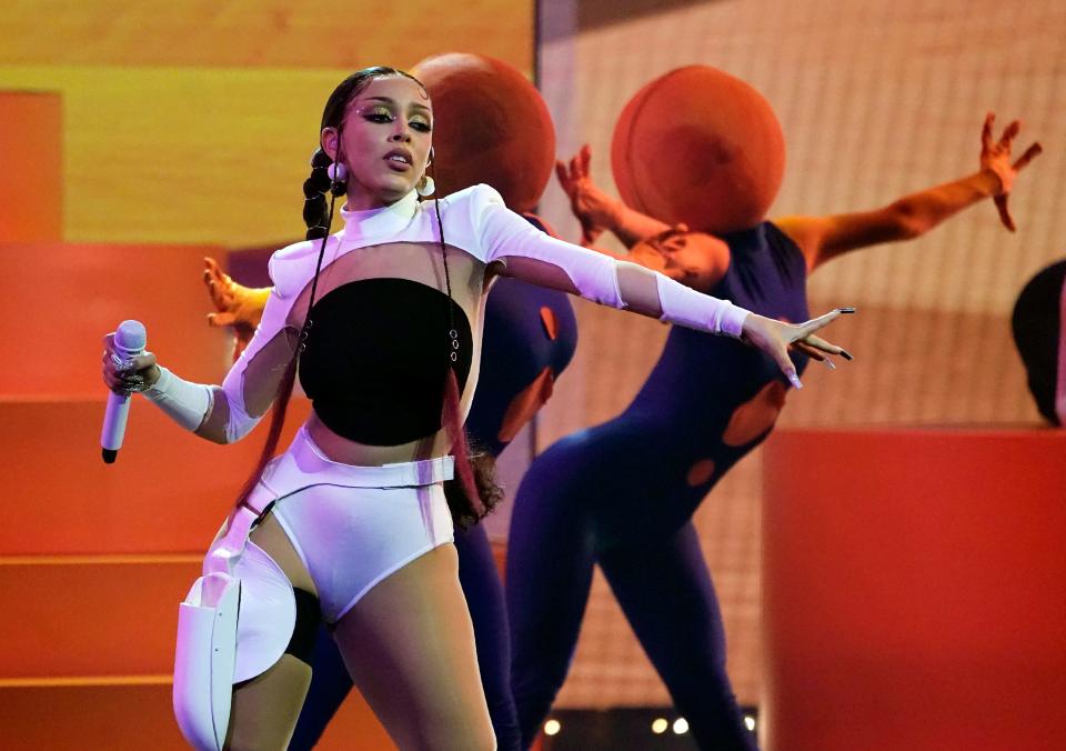 Doja Cat, shown performing at the 2021 Billboard Music Awards, released her third album, "Planet Her," in June 2021.