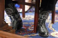 <p>The boots of Agriculture Secretary, former Georgia Gov. Sonny Perdue are seen as he testifies on Capitol Hill in Washington, May 17, 2017, before a House Agriculture Committee hearing on “State of the Rural Economy.” (Photo: Alex Brandon/AP) </p>