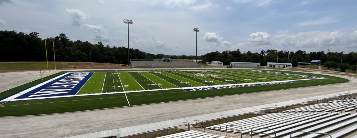 Jefferson County High School Warrior Field has been converted to artificial turf. Construction continues on the new Olympic track that should be completed by the time students return to class this fall.